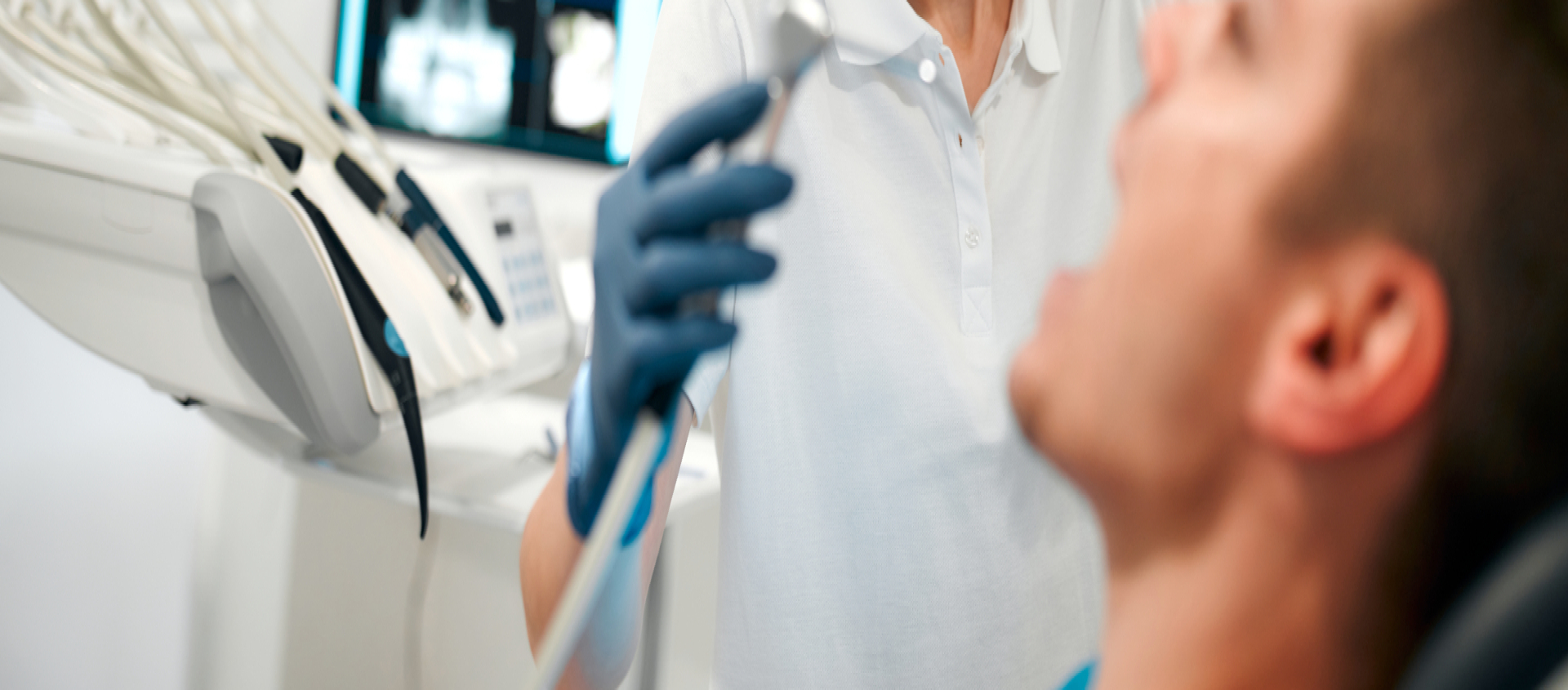 Dental worker working on someone's teeth