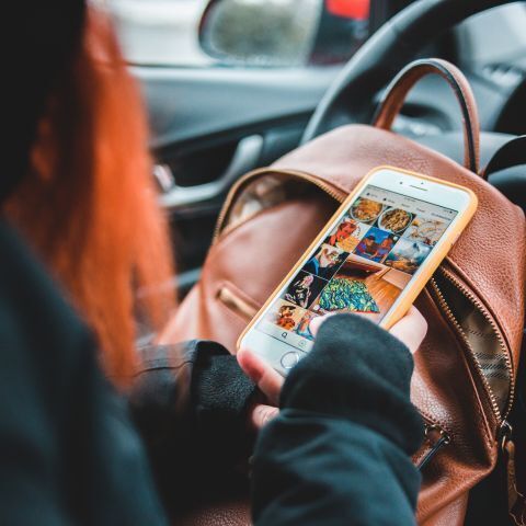 a woman scrolling on social media